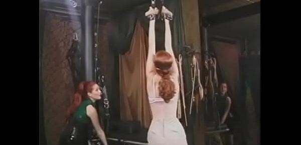  Beautiful blindfolded red head with an awesome ass gets disciplined in BDSM-room